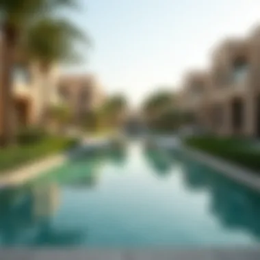 Community amenities including a pool and garden area near Al Sarfa Villas